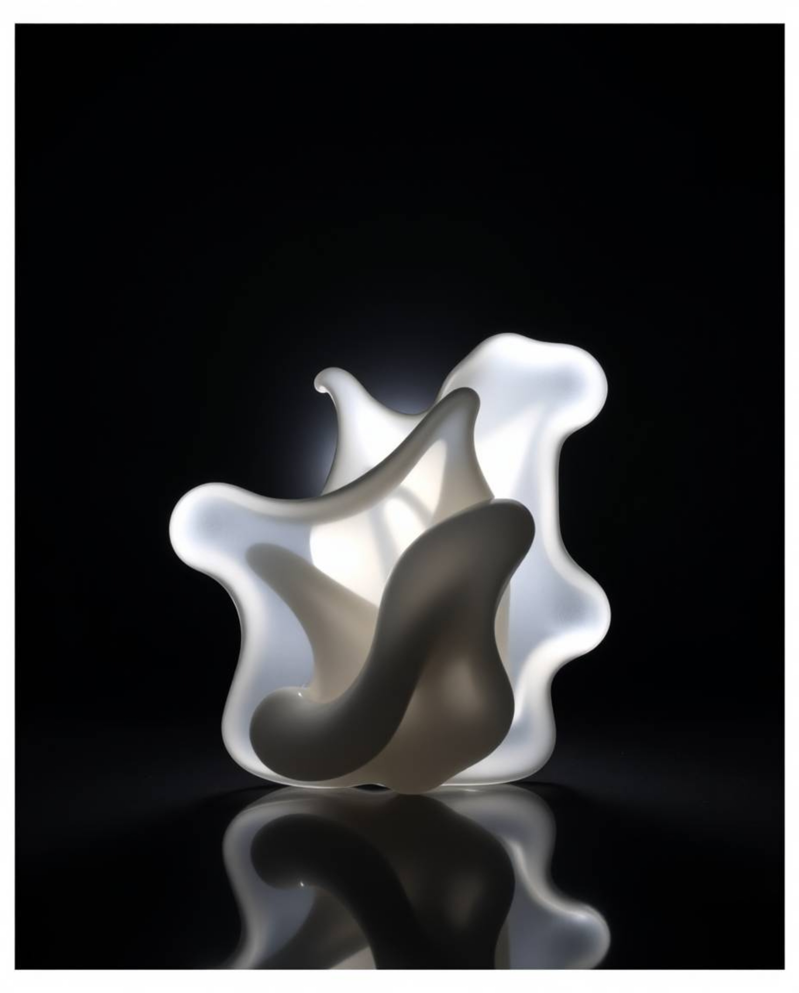Explore the captivating beauty of silhouetted backlighting illuminating sculptural 3D fluid shapes crafted from mercury.  The