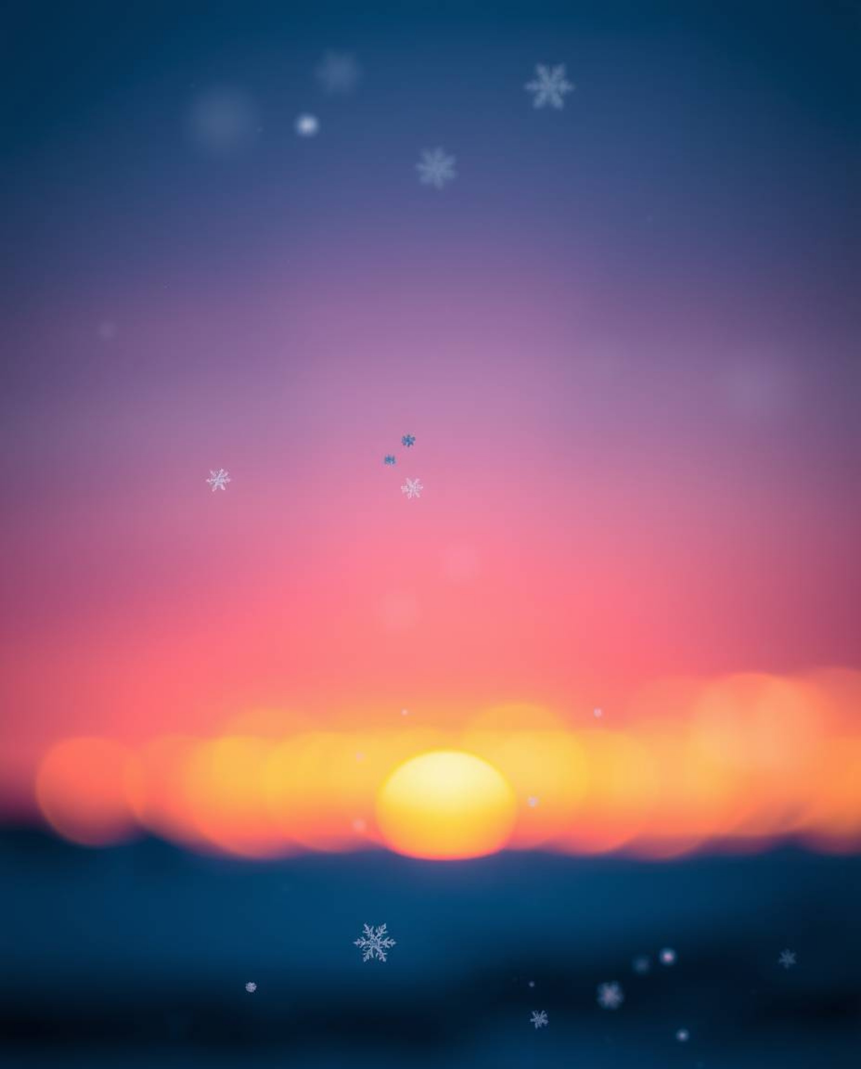 A soft cinematic image captures the serene beauty of snowflakes falling during a vibrant sunset. This picture is characterize