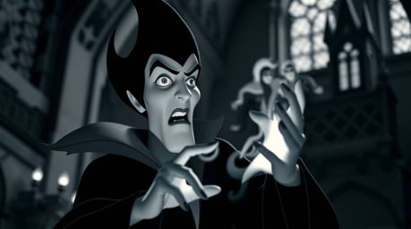 A captivating black and white photograph depicts a classic Disney villain casting a spell within the eerie ambiance of an old