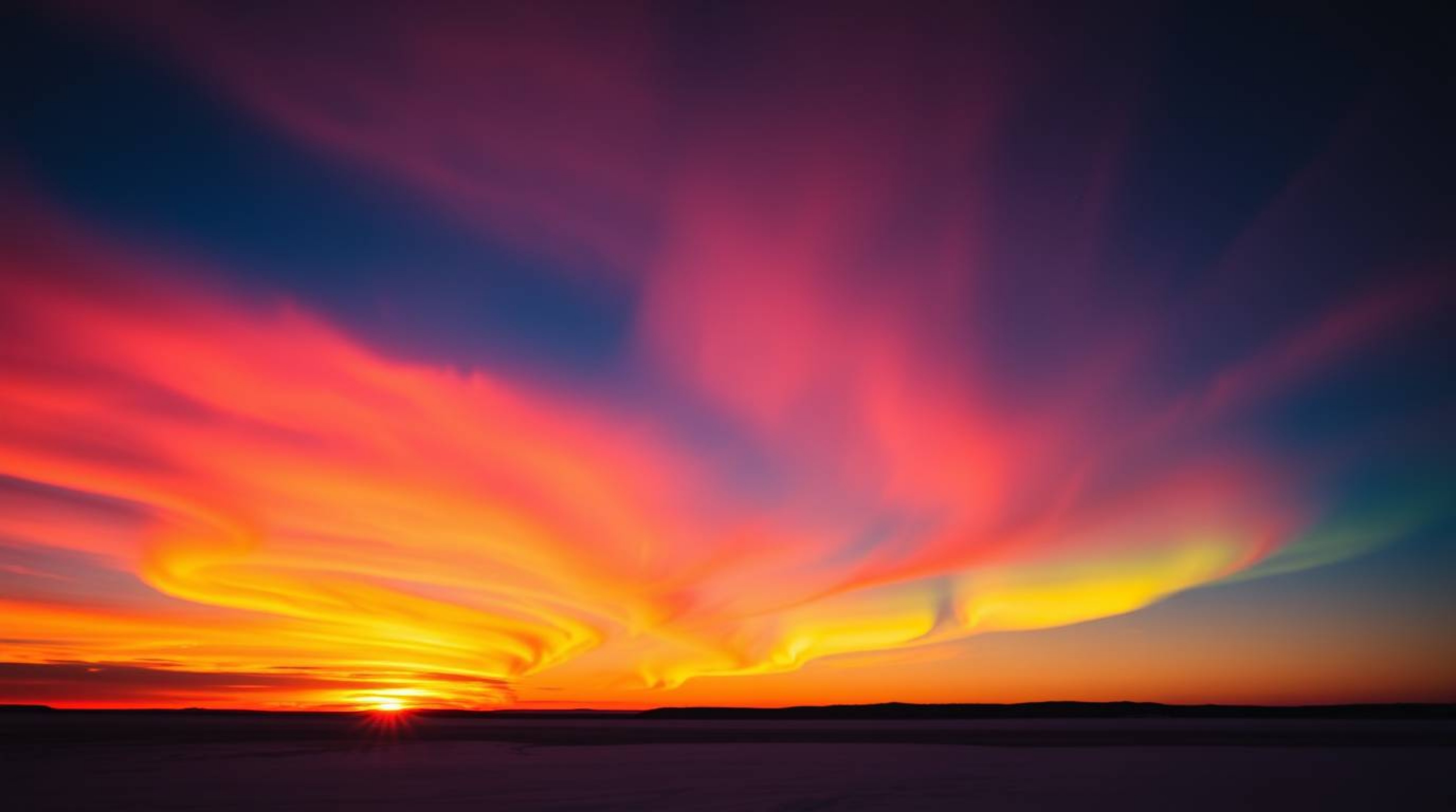 Witness the breathtaking spectacle of the Northern Lights dancing across a vibrant sunset sky. This captivating image showcas