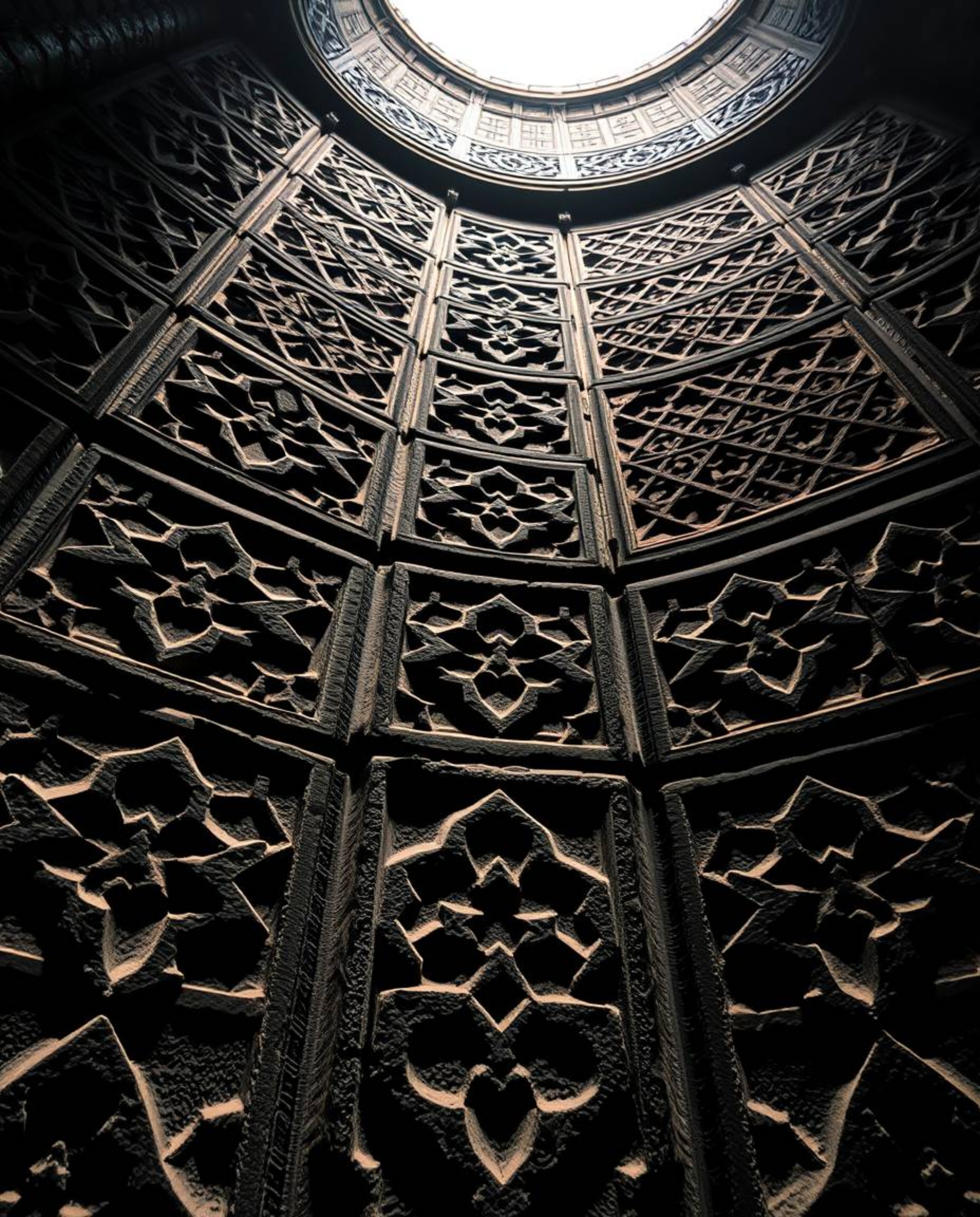 Explore stunning high-angle photographs showcasing Islamic geometric patterns deeply carved in stone.  These images capture t