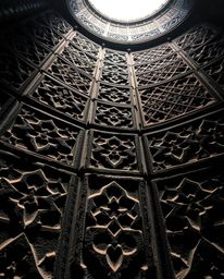 Explore stunning high-angle photographs showcasing Islamic geometric patterns deeply carved in stone.  These images capture t
