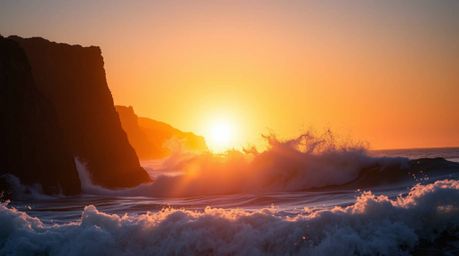 Experience the raw power and beauty of nature with these stunning images. Silhouetted against a fiery sunset, waves crash rel