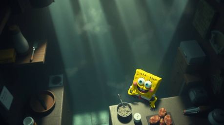 A whimsical birds-eye view animation depicts a sponge character preparing a meal in a vibrant underwater kitchen.  Volumetric