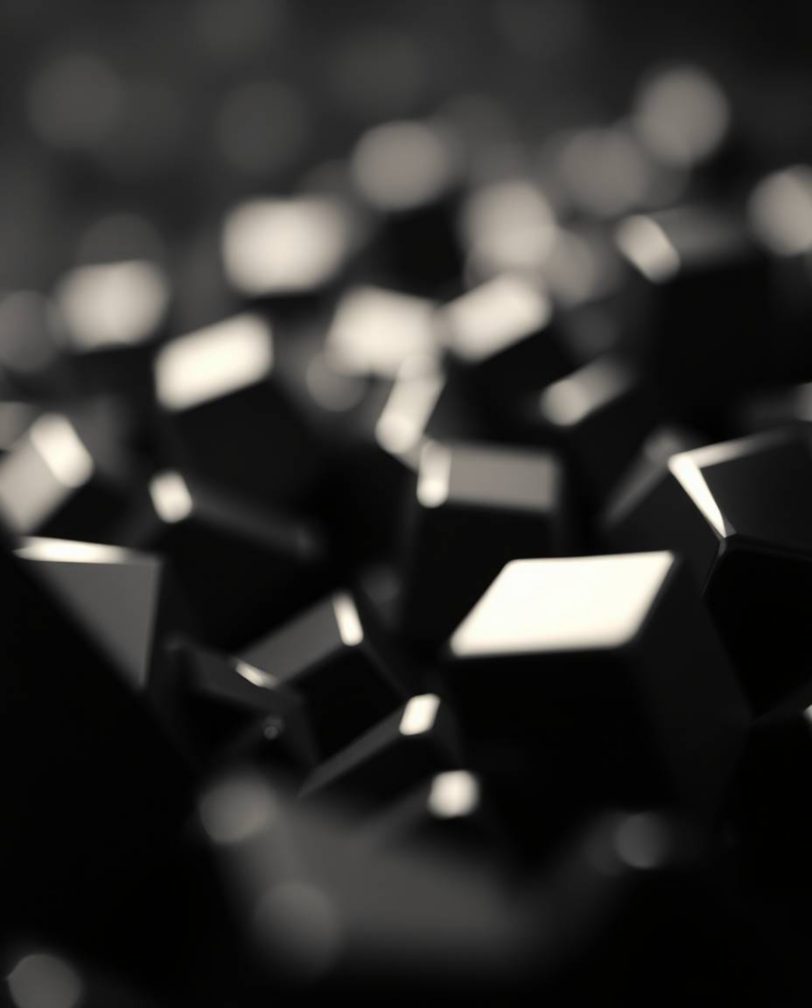 Experience the captivating allure of intense jet black futuristic 3D metallic shapes, sharply focused against a blurred bokeh