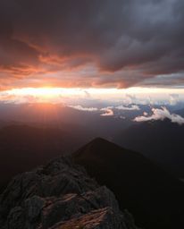 Experience a unique juxtaposition of styles with this depiction of a sunset from a high alpine peak. The scene combines an ad