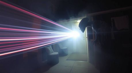 A captivating image depicting an alien within a mundane suburban setting.  Long exposure photography techniques highlight eth
