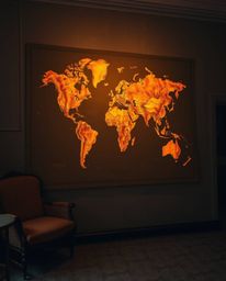 A graceful and elegant photograph showcasing the refined features of a glowing map projection within the setting of an old st