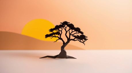 This image features an intricate origami style depicting a lone tree silhouetted against a fiery sunset. The dynamic motion i