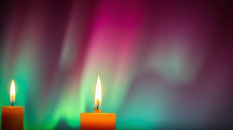 Experience the magic of warm candlelight illuminating an aurora borealis gradient texture, blending seamlessly with deep sky