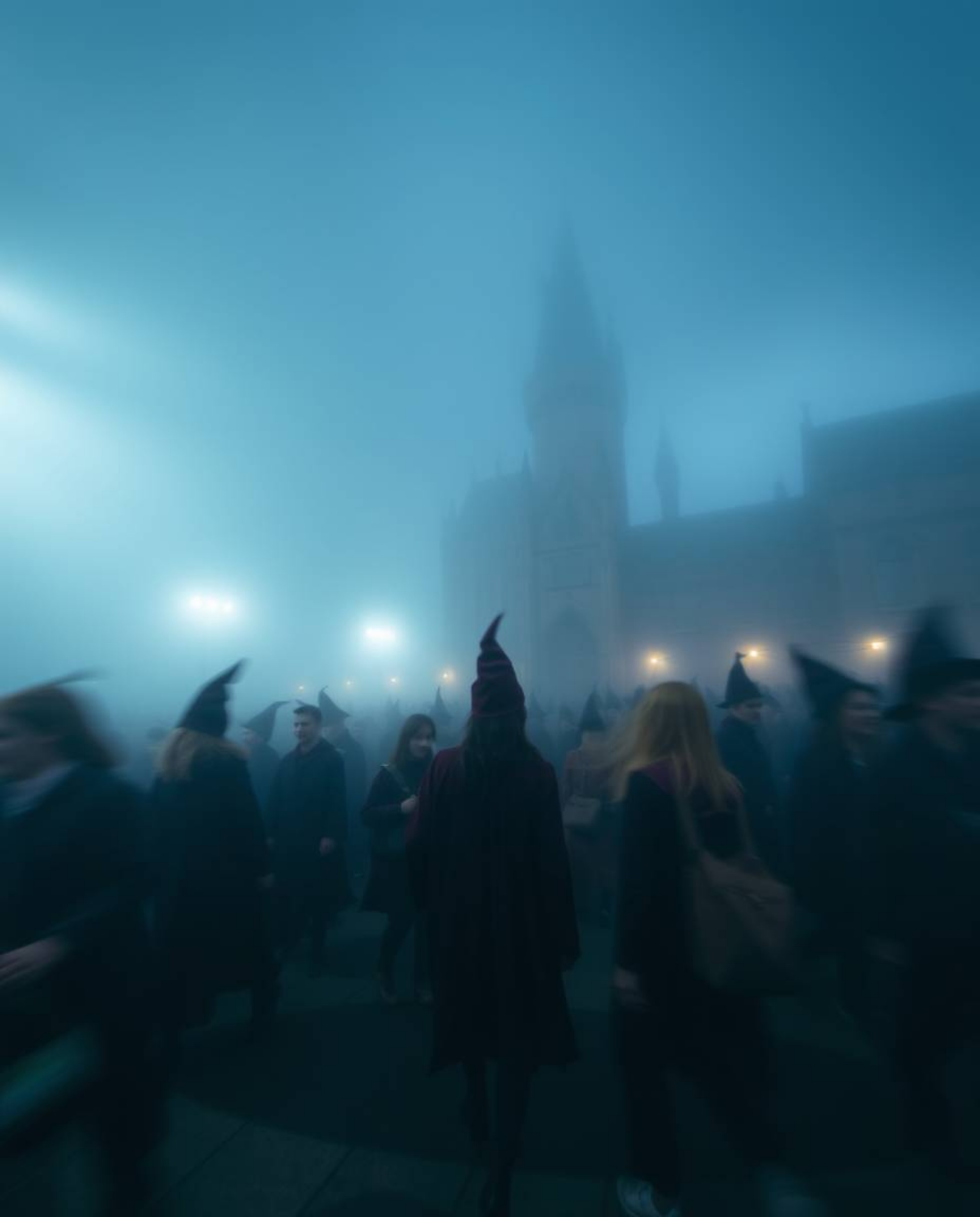 Experience the enchantment of a magical school veiled in thick fog, captured through a long exposure lens. This image portray