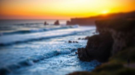 Experience the tranquility of waves crashing on majestic cliffs beneath a breathtaking sunset, captured with a captivating bl