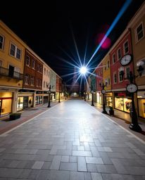 An empty town square, the scene punctuated by the rhythmic ticking of clocks, creates a surreal and captivating visual.  Capt