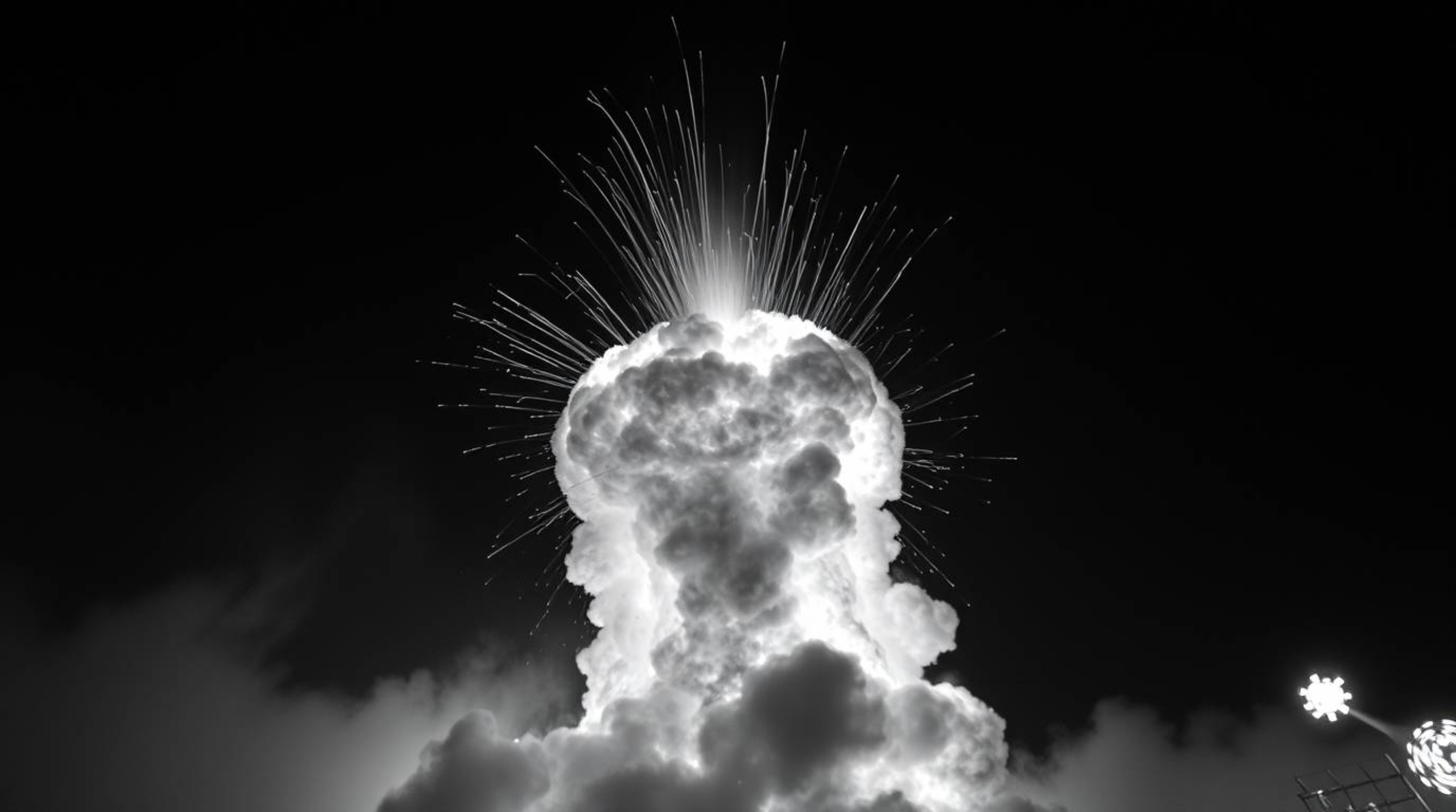 A timeless, elegant black and white photograph captures a dramatic, low-angle view of a TNT explosion in the Wild West.  The 