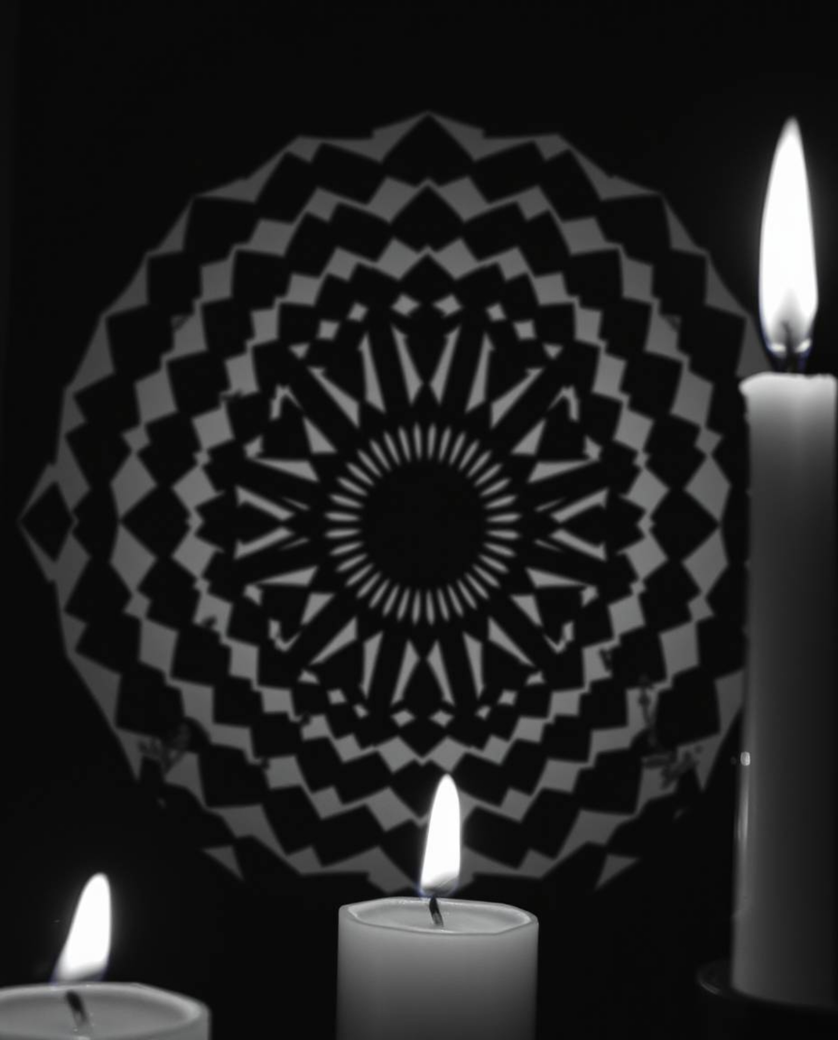 A captivating black and white image showcasing a geometric optical illusion pattern with a retro aesthetic, illuminated by th