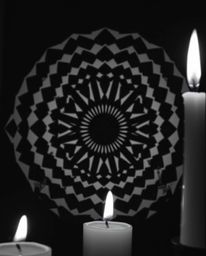 A captivating black and white image showcasing a geometric optical illusion pattern with a retro aesthetic, illuminated by th