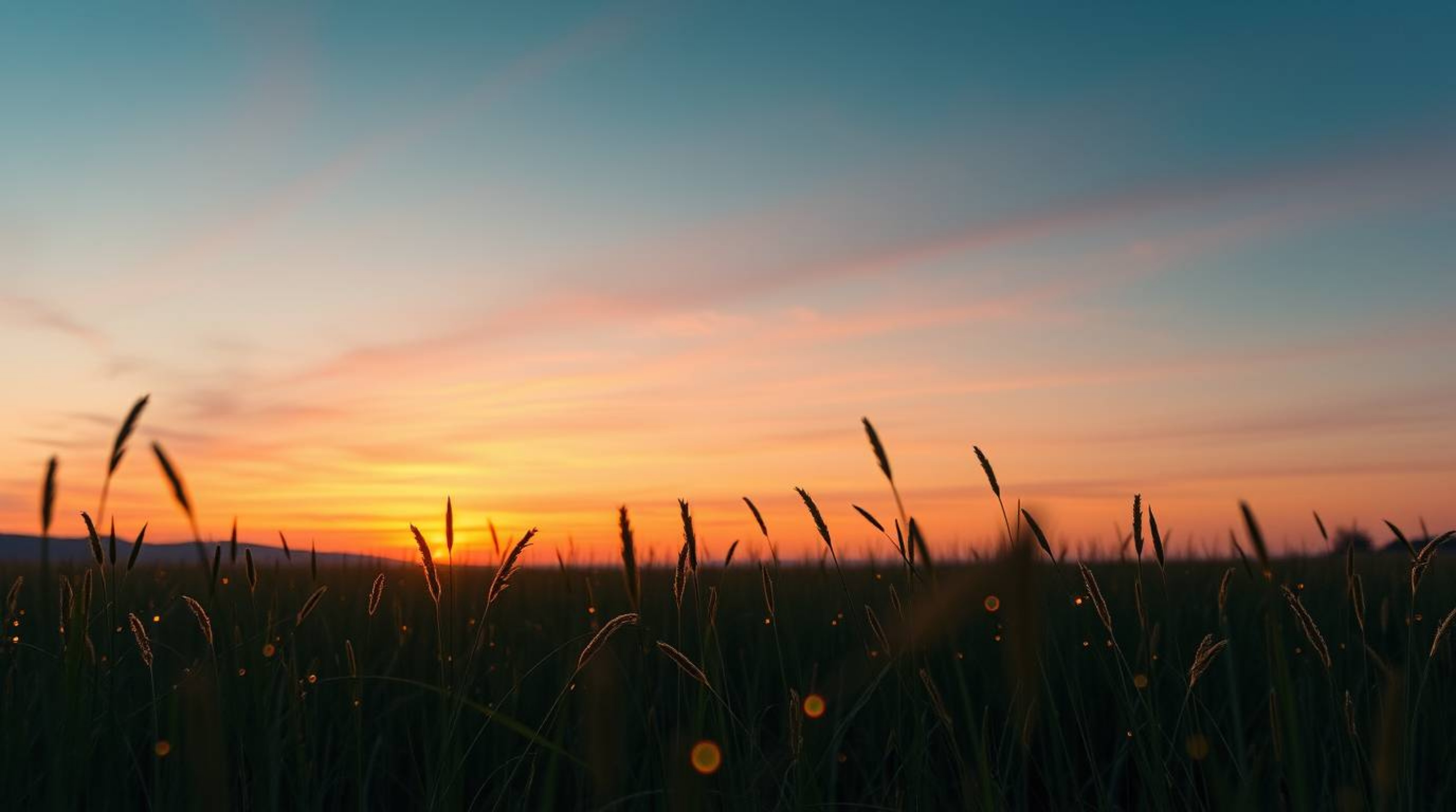 Capture the ethereal beauty of a sunset over a tranquil meadow, illuminated by the gentle glow of fireflies. This fine art ph