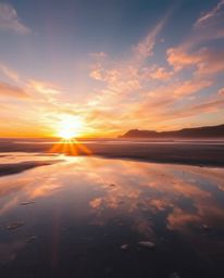 A dreamy, soft image captures a sunset sky mirrored in tidal pools on the beach. This visually stunning scene features a brig