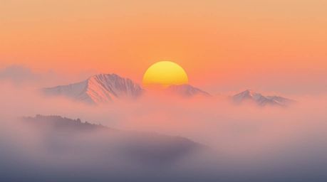 Experience the serene beauty of snow-capped mountains bathed in the warm glow of an autumn sunset.  Thick fog adds an etherea