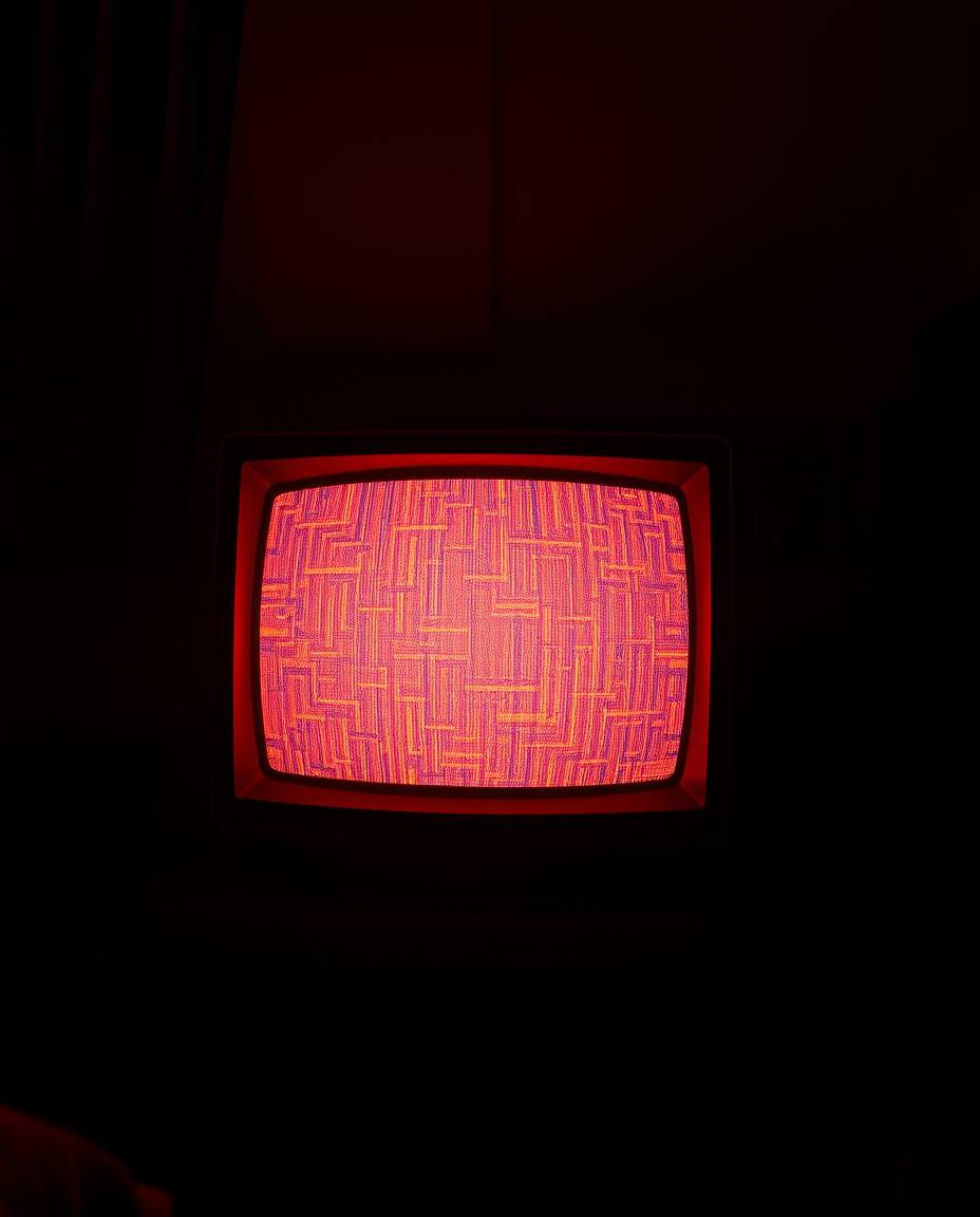 A retro-styled TV screen displays warm RGB separated glitch static, bathed in the golden hour's soft, orange glow.  The eerie