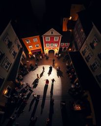 Experience a vibrant musical number unfolding in a sun-drenched town square, captured from a breathtaking bird's eye perspect