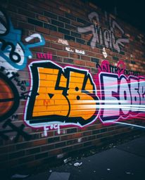 Capture the vibrant energy of street art with this stunning long exposure photograph.  Colorful graffiti explodes across a te