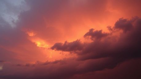 Experience an intense dramatic scene featuring a stormy sunset sky gradient, rendered with soft and dreamy textures that evok