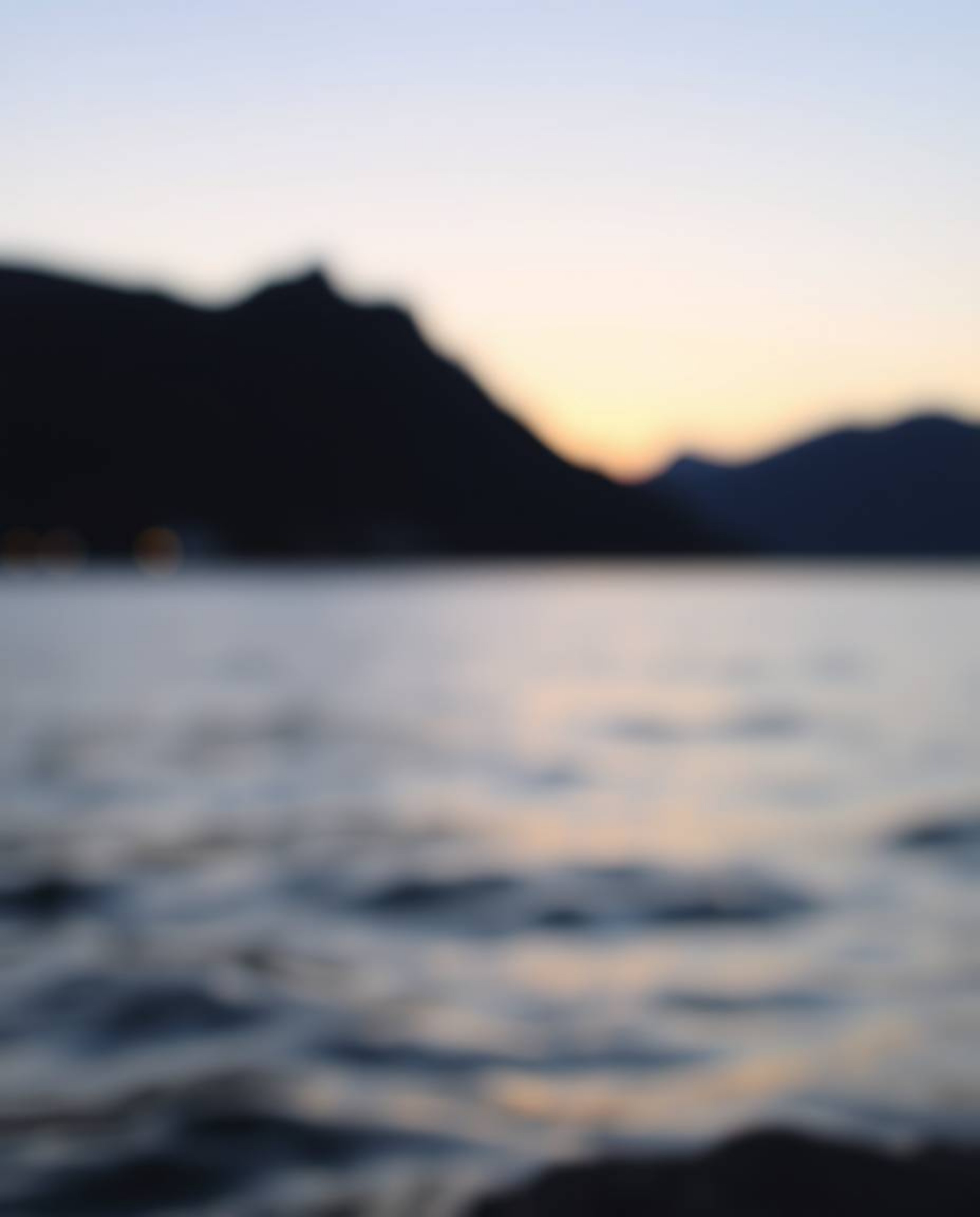 This artwork depicts the reflection of a sunset in a glassy fjord using a modern flat design style. The composition features 