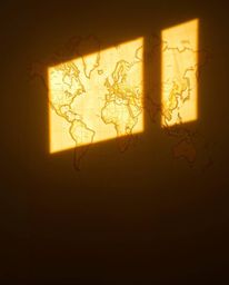 An image of a glowing map projection in an old study, illuminated by gentle soft light. The artwork utilizes natural earth to