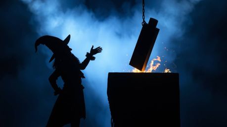 A high-resolution stock photo depicts a silhouetted trickster character in a perilous situation, about to be struck by a fall