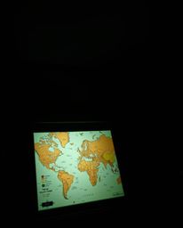 Explore the captivating allure of high contrast visuals featuring a glowing map projection in an old study. This image combin