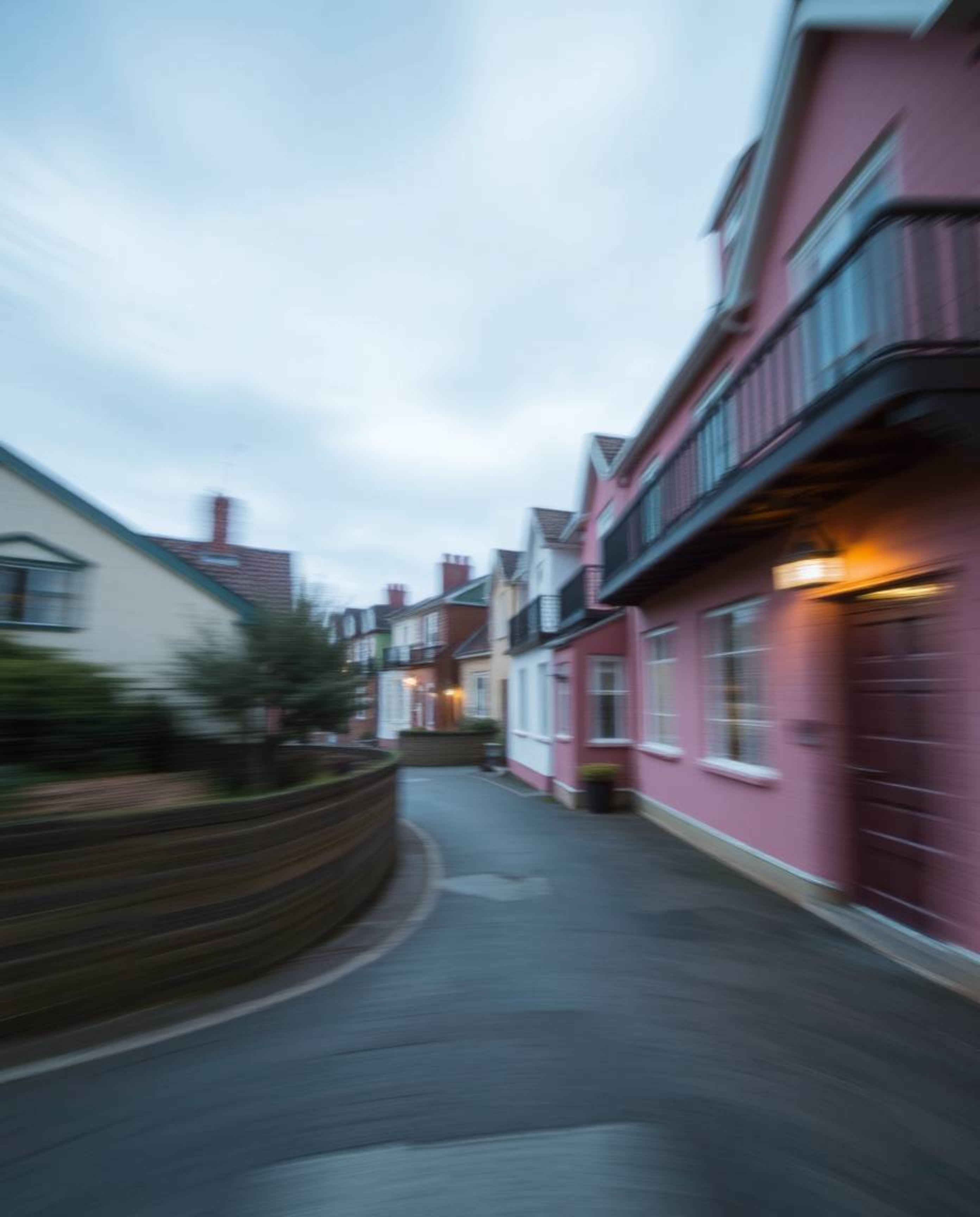Explore the serene beauty of long exposure photography featuring a sleepy town rendered in a watercolor style. Imagine pastel
