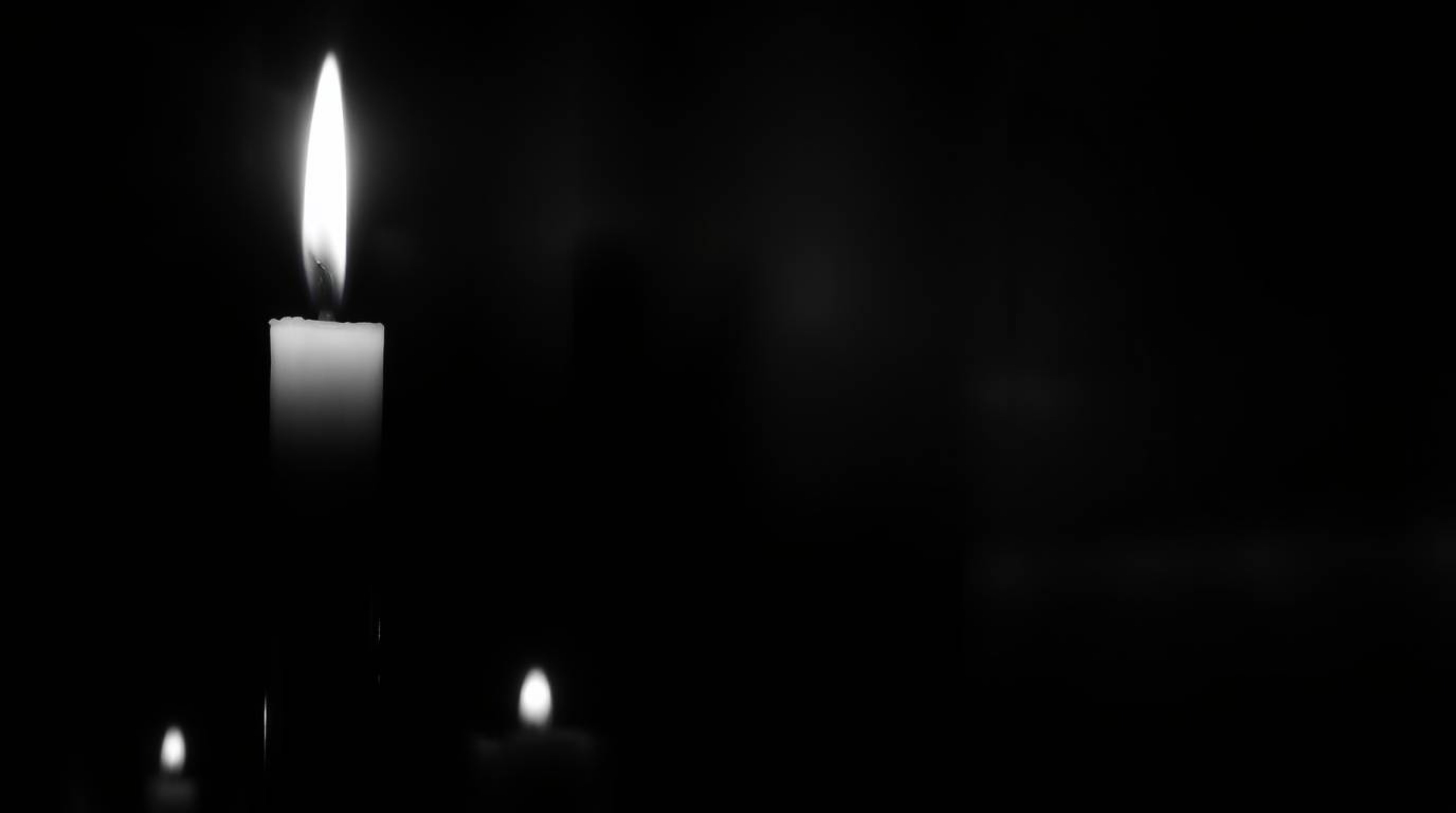Capture the essence of ethereal spiritual vibes with warm candlelight in a classic black and white image.  Inspired by the me