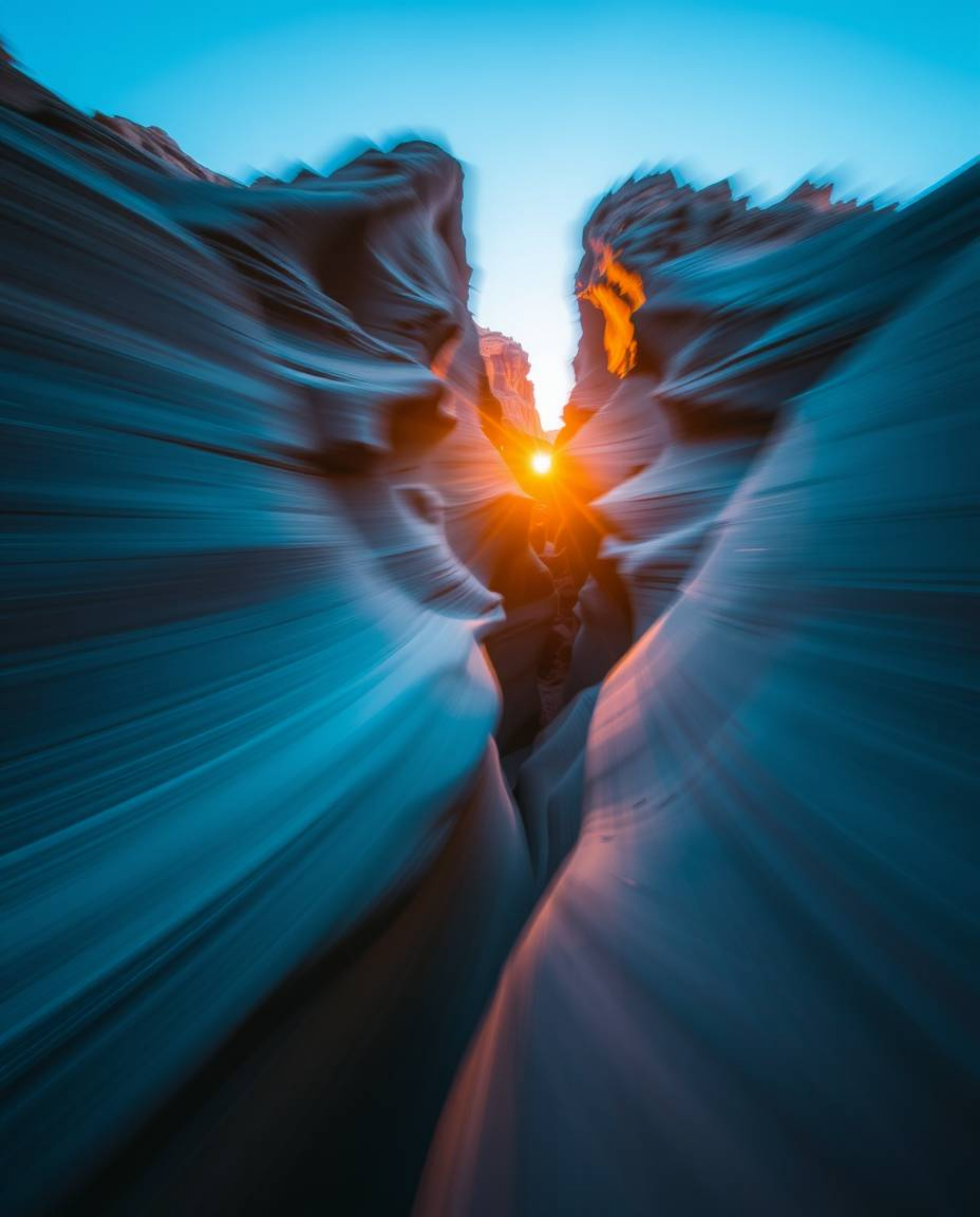 This artwork captures a dynamic motion scene of a sunset illuminating sandstone cliffs in a canyon, interpreted through a str