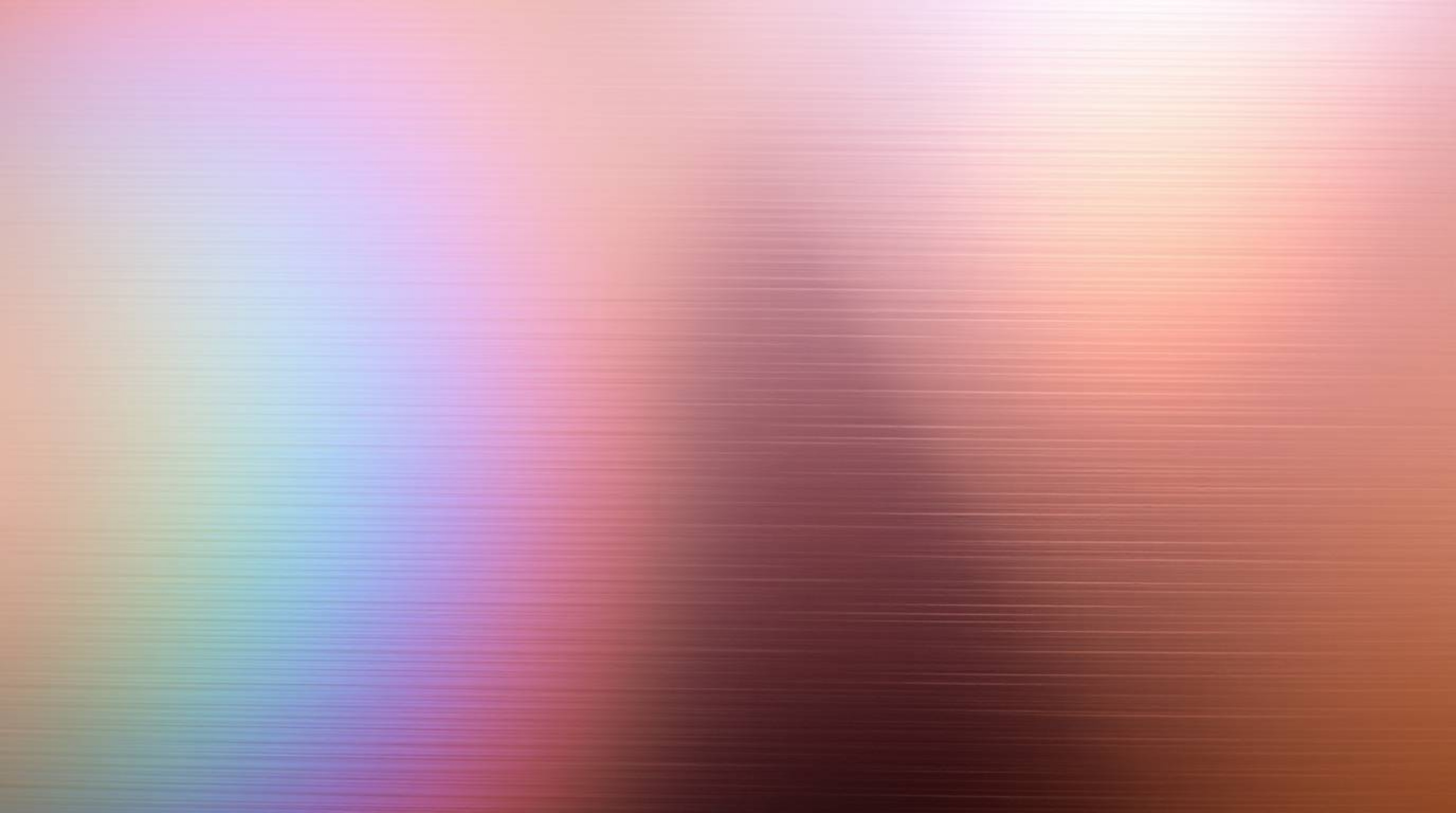 Explore stunning long-exposure photographs showcasing iridescent gradient textures on a metallic surface.  Vibrant color shif