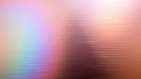 Explore stunning long-exposure photographs showcasing iridescent gradient textures on a metallic surface.  Vibrant color shif
