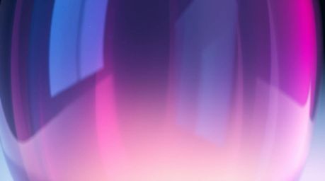 A captivating close-up showcases a glass object reflecting smooth gradient textures with vibrant complementary colors. Volume