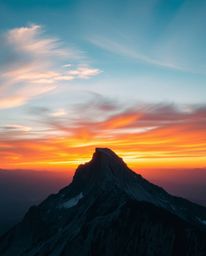 Experience a high alpine peak sunset rendered in vibrant complementary colors, creating a mystic and enchanting environment. 