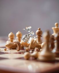Witness the captivating chaos of a chessboard frozen in a moment of destruction. This extreme macro close-up captures the int