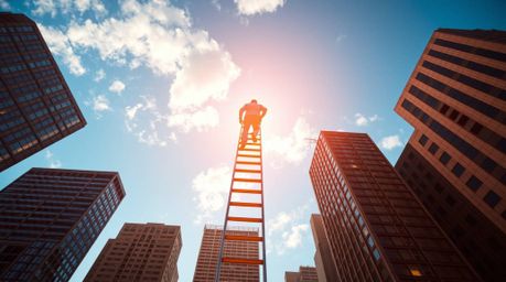 An abstract artwork depicting a businessperson ascending a transparent ladder into a vibrant blue sky above towering skyscrap