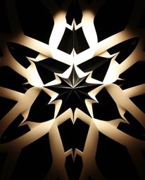 Explore captivating black and white geometric patterns in an optical illusion style, evoking a sense of retro nostalgia. This