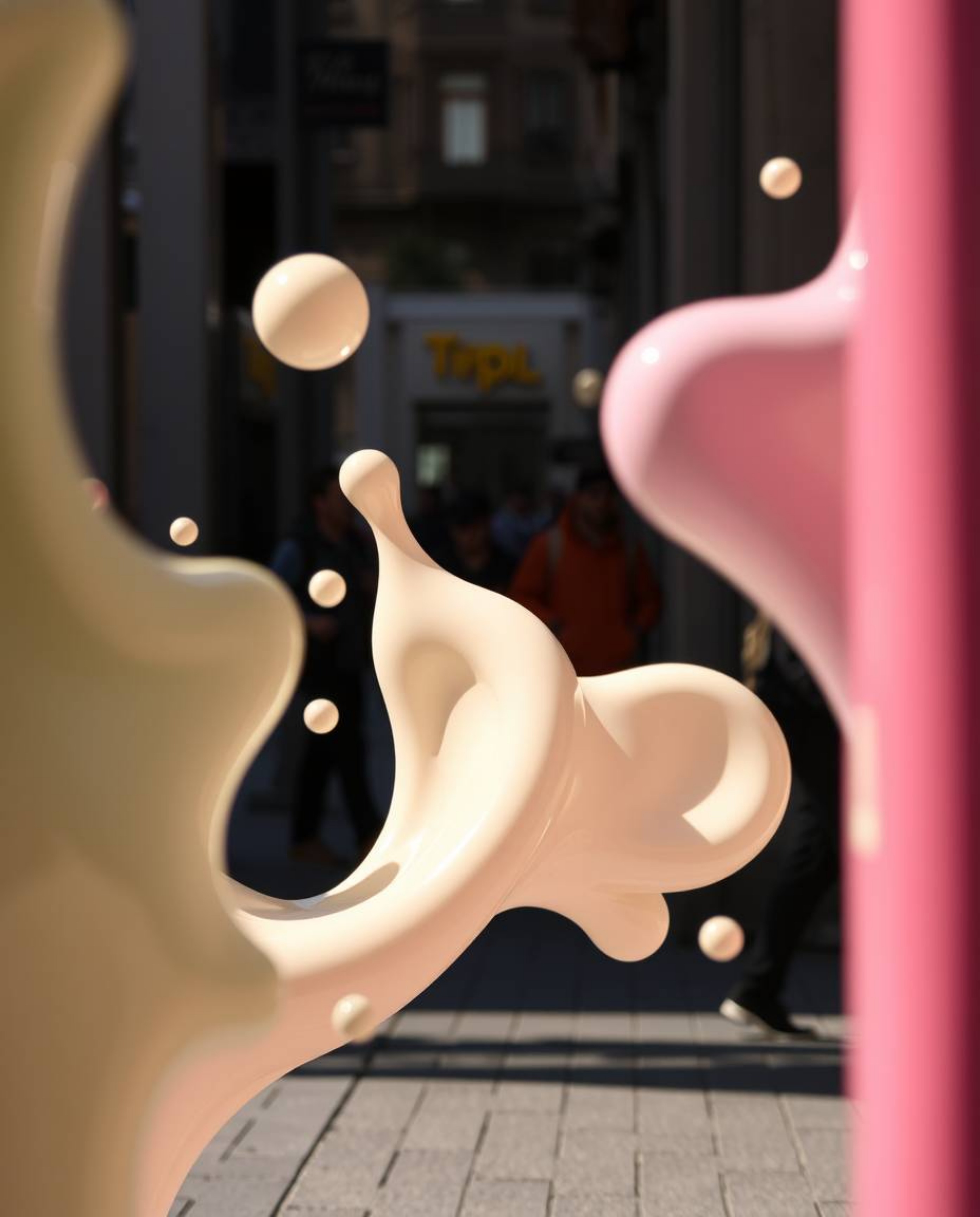 Explore captivating candid street photography showcasing abstract liquid forms rendered in 3D with a soft, pastel color palet
