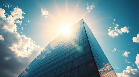 Experience an epic scene of a modern glass building dissolving seamlessly into the sky, bathed in bright, vibrant colors and 