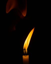 Capture the mesmerizing beauty of warm candlelight in this unusual and original fine art photograph. Dynamic colorful splashe