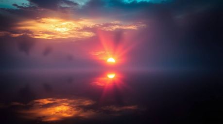 A stunning scene featuring volumetric lighting and a low angle perspective. The reflection of a colorful sunset shimmers on a