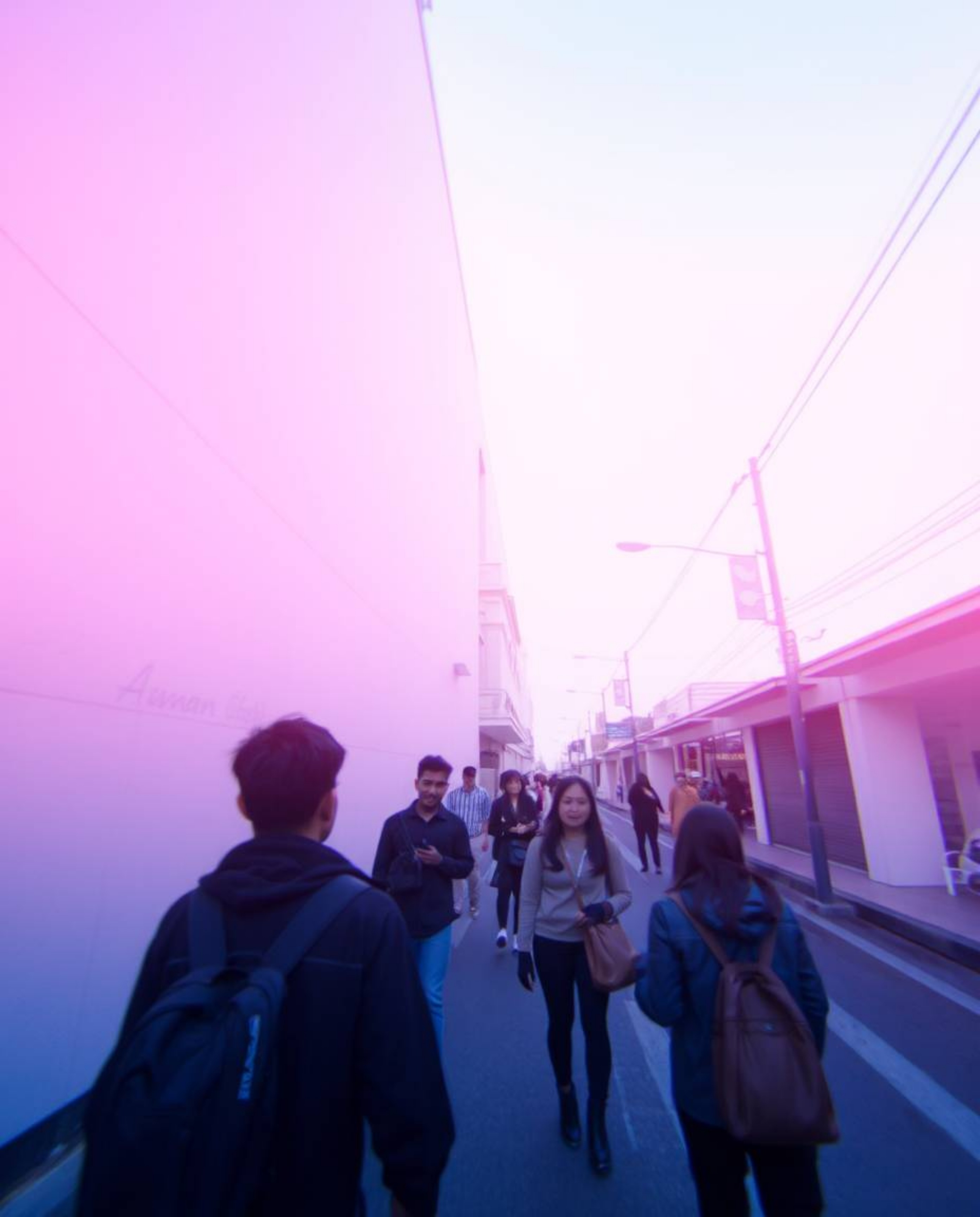 This captivating street photograph offers a candid, bird's-eye view perspective of spontaneous moments in an urban environmen