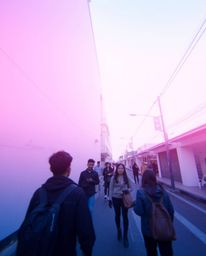 This captivating street photograph offers a candid, bird's-eye view perspective of spontaneous moments in an urban environmen