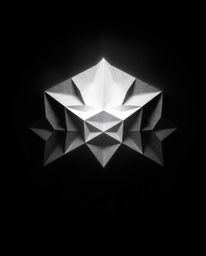 Experience a dreamlike cinematic composition in monochrome, featuring a captivating 3D geometric pattern reminiscent of folde