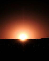 This image utilizes high contrast and low-key lighting to create a powerful and dramatic effect. It features a distinct split
