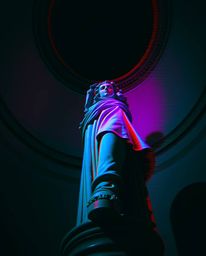 A dramatic low-angle shot showcases a classical sculpture infused with a vibrant glitch effect.  The digital corruption theme